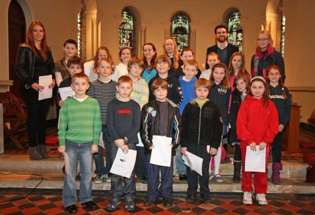 The Revd Sonia Gyles with teachers and and the school choir of Sandford Parish National School before the Annual School Carol Service.