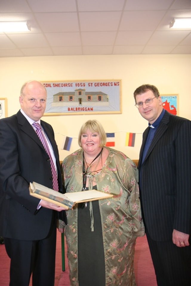 Pictured with the first Minutes book of St Georges NS Balbriggan are (left to right) Robert Cashell, Chairman of the Board of Management, Pauline O'Shea, Principal and the Revd Alan Rufli, Rector. St Georges NS recently celebrated 150 years in existence.