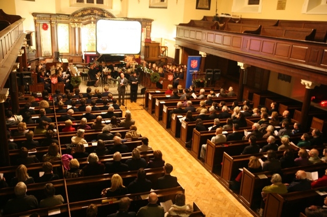 The Vicar of St Ann's Church, Dawson Street welcoming everyone to the Salvation Army Carol Service in the Church.