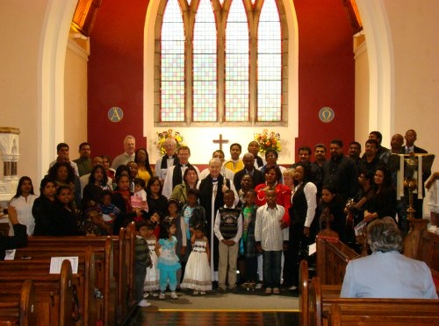 A section of families present in a group photograph at the Discovery Diocesan Thanksgiving Service with Archbishop Jackson and his wife.