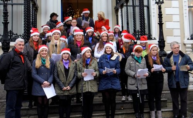 The choir, Teen–Spirit, with the readers and organisers braved gales and occasional rain for the annual ecumenical carol singing on the steps of the Mansion House on Saturday December 14. 