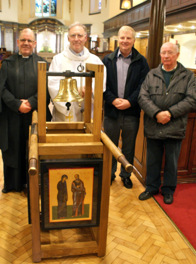 St Ann’s verger, Fred Deane, the Revd Canon Adrian Empey, Revd Dermot McNeice of the Eucharistic Congress staff and St Ann’s parishioner William Clarke are pictured with the Eucharistic Congress bell when it was brought to St Ann’s Church, Dawson Street, as part of its tour of the country. 