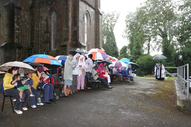 Worshipers brave the weather at the Clonsilla Songs of Praise Service led by the Revd Elaine Dunne and Stella Obe (both right).