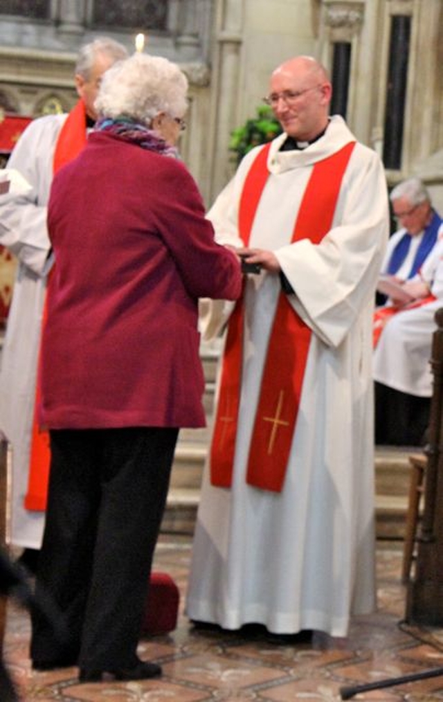 The new rector of Raheny and Coolock, the Revd Norman McCausland, is presented with the gifts of ministry during his service of institution in All Saints’ Raheny on Friday November 29. 
