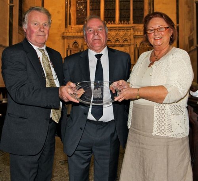 Organist John Keogh is presented with a gift in honour of his 50 years of service playing music in St Saviour’s, Arklow.