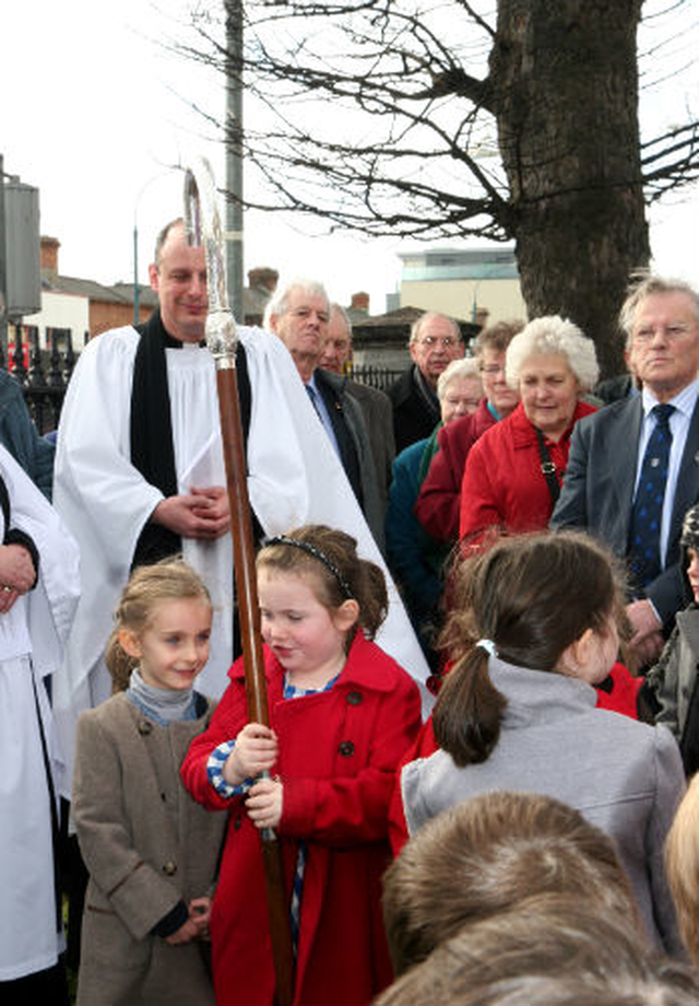 This little girl was given the responsibility of minding the Archbishop’s crosier while he dedicated the new noticeboard for North Strand Church and St Columba’s School which was erected in memory Cecil Cooper.