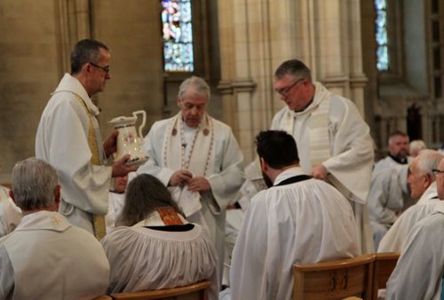 Archbishop Michael Jackson, Dean Dermot Dunne and the Revd Garth Bunting during the Maundy Thursday footwashing in the Chrism Eucharist at Christ Church Cathedral. 