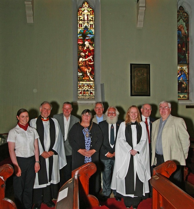 Caroline Scott, Stena; Canon Adrian Empey; Eamon Hewitt, Communications Manager, Stena; Jean Llewelyn Williams, Deputy Mayor of Holyhead; Joe Ryan, Irish Maritime Institute; Richard Burrell, Holyhead Maritime Museum; the Reva Sonia Gyles; Brian Scott, Stena and service organiser; and Terry Doyle, Dun Laoghaire Port Manager, Stena, standing in front of the window to commemorate WG Skipworth at the Service to mark 450 years of mail services between Dublin Area and Holyhead which took place at St Philip's, Milltown. Photo: David Wynne.