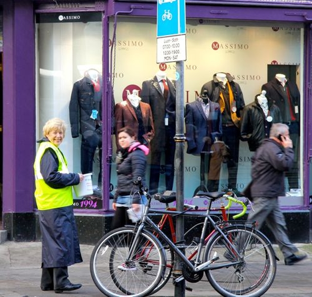 Anne O’Regan collecting for the Black Santa Sit Out on Dawson Street. 