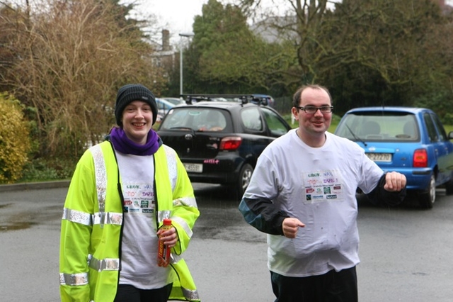 Jacob Caldwell and Naomi Quinn, both ordinands at the Church of Ireland Theological Institute finish their run and cycle for charity at the institute.