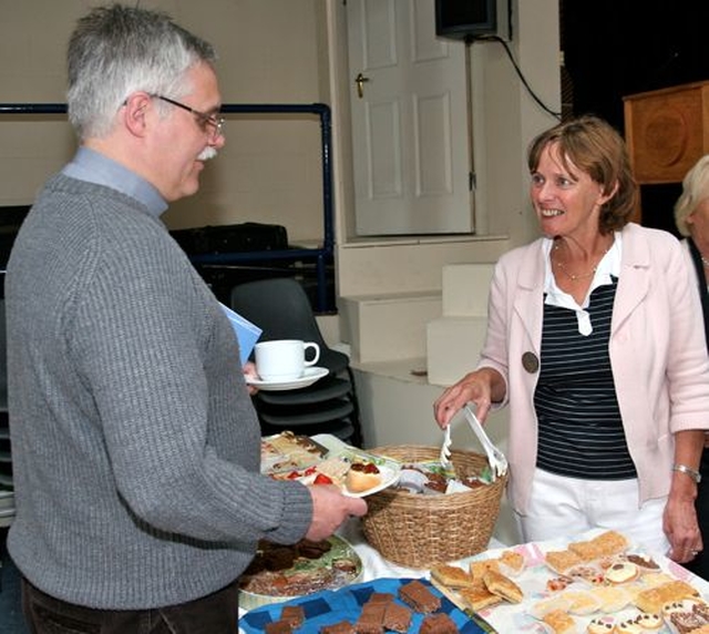 Margaret Davis serves tea to Revd Ken Rue at Wicklow Parish Fete. 