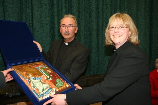 The Revd Ruth Elmes receives the gift of an Icon from the parishioners of St Brigid's Church, Stillorgan after her ordination in the Church. Also pictured is the Rector of St Brigid's Stillorgan and All Saint's Blackrock, the Revd Ian Gallagher. 