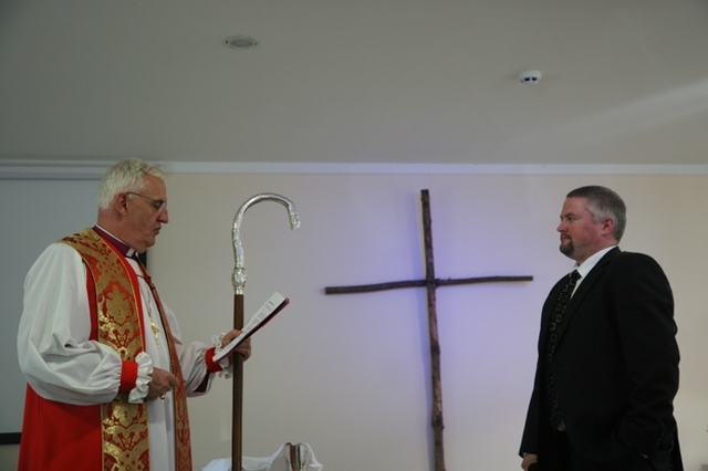 The Archbishop of Dublin and Bishop of Glendalough, the Most Revd Dr John Neill commissions Alan Breen as the new youth pastor in Redcross.