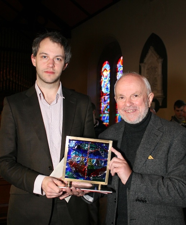 David Bremner receiving an award for his work as organist at Sandford Parish. Also pictured is George Walsh, designer of the award. Photo: David Wynne