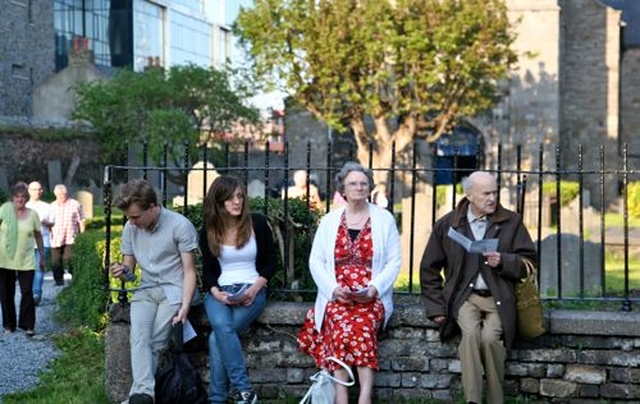 Parishioners  of St Michan’s enjoy a balmy May evening as they await the start of the service to dedicate the new Smithfield entrance to the churchyard. 