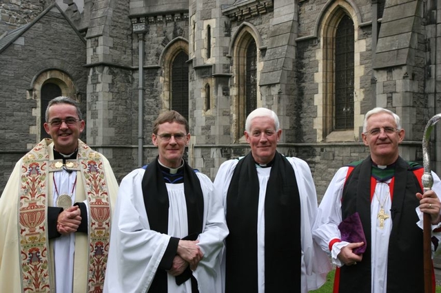 The Revd Canon Mark Gardner (2nd left) and the Revd Canon Robert Deane (2nd right) with the Dean of Christ Church, the Very Revd Dermot Dunne (left) and the Archbishop of Dublin, the   Most Revd Dr John Neill following the installation of Canons Gardner and Deane to Christ Church Cathedral Chapter.