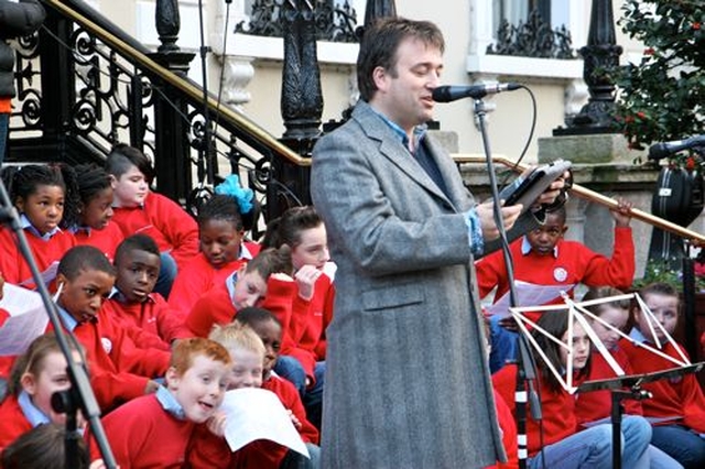 Spirit Radio’s Ronan Johnson delivers a reading at the Community Carol Singing outside the Mansion House on Saturday December 15.