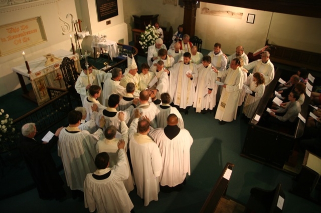 The laying on of hands at the ordination of the Revd David MacDonnell to the priesthood in St Michan's Church, Dublin.