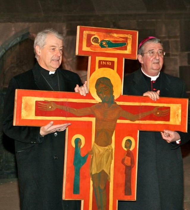 Archbishop Michael Jackson and Archbishop Diarmuid Martin outside Christ Church Cathedral as they prepare to carry the Taizé Cross for the Ecumenical Procession of the Cross through the streets of Dublin to the Pro–Cathedral on Good Friday.