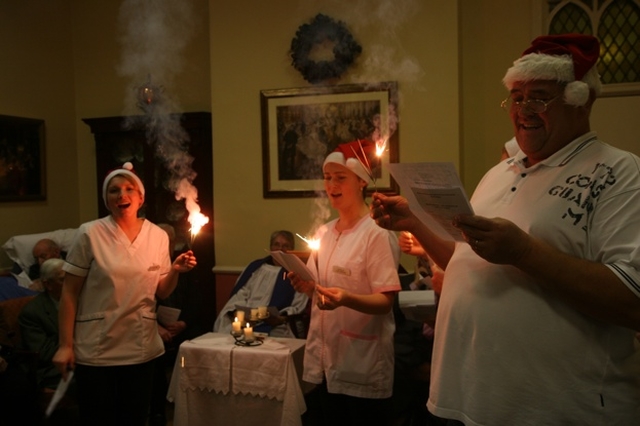 The Polish members of staff at St John's House sing a carol from their native land for residents at St John's House.