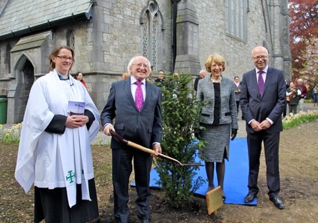 President Michael D Higgins planted a yew tree in the grounds of the Church of St John the Baptist in Clontarf before the service to commemorate the 1,000th anniversary of the Battle of Clontarf. Also pictured are the Rector, the Revd Lesley Robinson; Mrs Sabina Higgins; and select vestry member, Mr John Patten. 