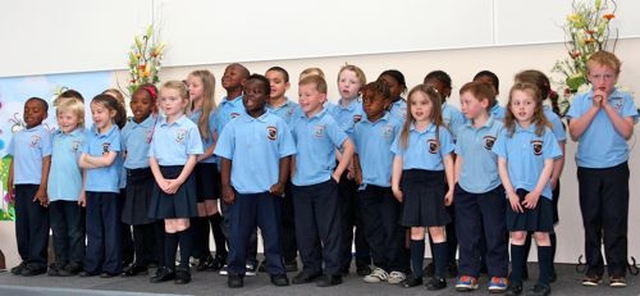 Junior and senior infants of Athy Model School perform at the official opening and blessing of their new building. 