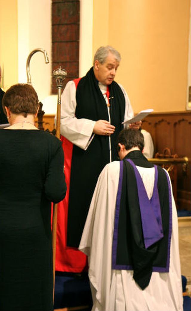 The new rector of Holy Trinity, Killiney, Revd Niall Sloane, kneels before Archbishop Michael Jackson at his Service of Institution.