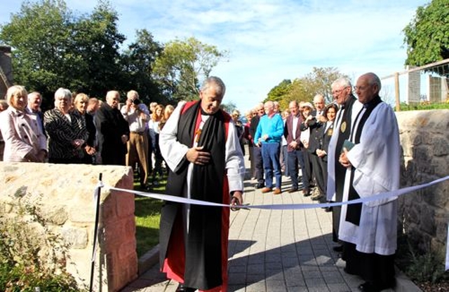 Archbishop Michael Jackson cuts the ribbon following the dedication and official opening of The Stables at Whitechurch Parish which have been reconstructed and extended. 