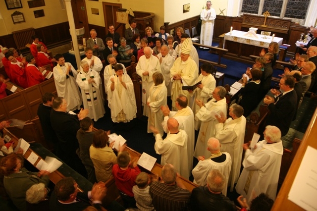 The Revd Ruth Elmes (centre) receives the congratulations of fellow diocesan clergy and the congregation at her ordination in St Brigid's Church, Stillorgan.