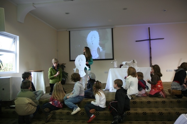 Susan Heaney introduces Mr Worried during the children's talk at the service in Redcross for the dedication of Trinity Hall Worship Centre and the commissioning of a new youth pastor.