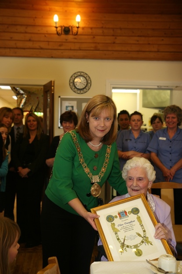 The Lord Mayor of Dublin, Cllr Emer Costello presenting 100 year old Olive Vaughan with a Certificate on her birthday in the Brabazon House.