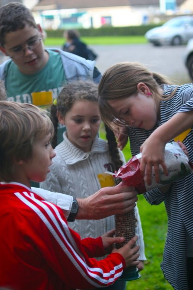 Filling the bird feeder at the launch of the JAM club in Straffan, Co Kildare.