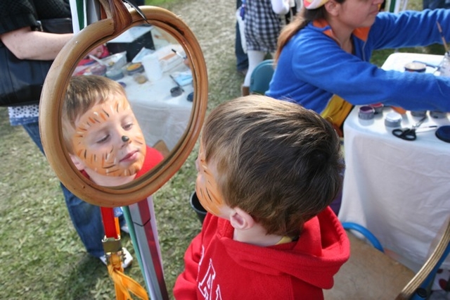 Checking out the facepainting job at the Rathmichael Parish Fete.