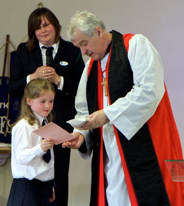 Archbishop Michael Jackson presents a special national certificate for Bible Study at the Diocesan Girls Friendly Society Festival Service which took place in Trinity Hall, Redcross, on Sunday May 26.  Also pictured is GFS Diocesan President, Myra Moody.