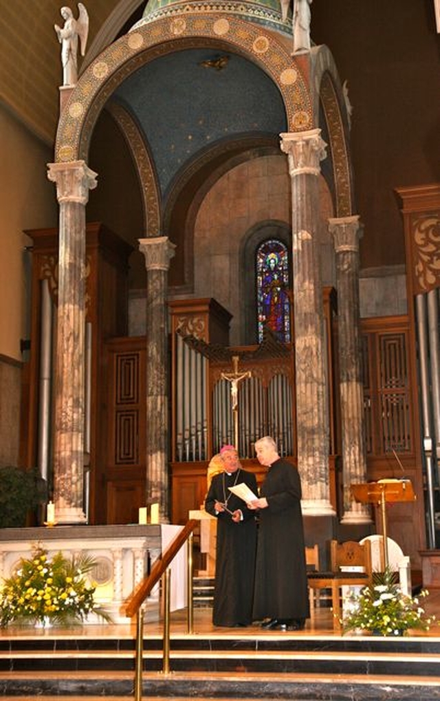 Archbishop Diarmuid Martin and Archbishop Michael Jackson on the alter of Our Lady of Mount Carmel Church on Whitefriar Street having completed the first stage of the Dublin Camino as part of the International Eucharistic Congress. 