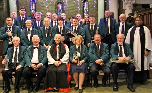 Archbishop Michael Jackson and the Revd Obinna Ulogwara with St George’s Brass Band who performed at the Discovery International Carol Service in St George and St Thomas’s Church on December 8. 