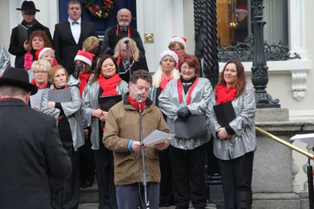 RTE’s David Davin Power reading at the Community Carol Singing on the steps of the Mansion House. 