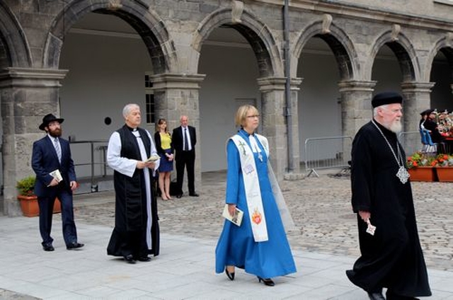 The Faith Leaders process into the quadrangle of the Royal Hospital Kilmainham for the ceremony to mark the National Day of Commemoration today, July 14. Pictured are the Revd Fr Thomas Flanagan of the Coptic Orthodox Church in Ireland; the Revd Dr Heather Morris, President of the Methodist Church in Ireland; the Most Revd Dr Michael Jackson, Archbishop of Dublin; and Rabbi Zalman Lent of the Jewish Community in Ireland. 