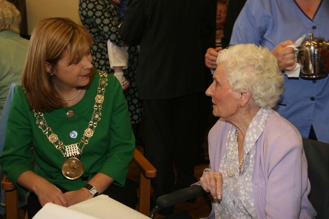 The Lord Mayor of Dublin, Cllr Emer Costello chatting with Olive Vaughan in the Brabazon House at Olive's 100th birthday party.