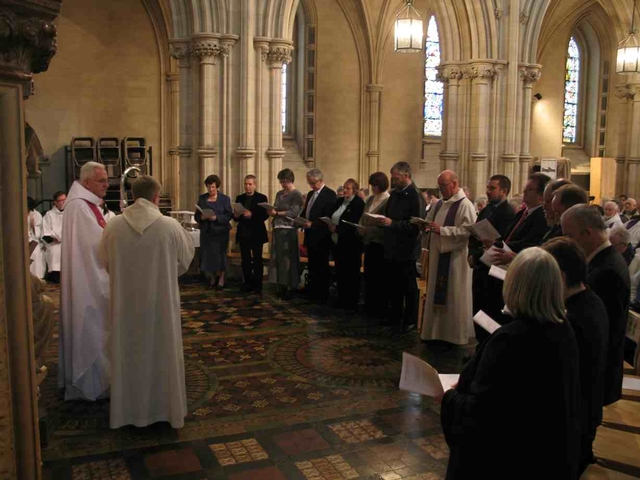 The Archbishop of Dublin, the Most Revd Dr John Neill (left) commissioning fourteen parish readers at the Chrism Eucharist Service in Christ Church Cathedral.