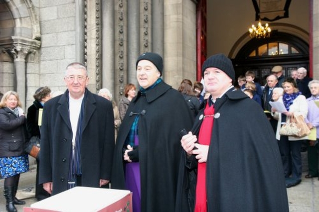 Archbishop Diarmuid Martin, Archbishop Michael Jackson and Vicar of St Ann’s Revd David Gillespie during the Black Santa Sit Out.