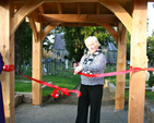 Marjorie Mold cuts the ribbon on the new lych gate at Powerscourt Church in Enniskerry. 