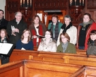 Siobhan Kilkelly, conductor, pictured with members of the Sandford and Milltown choirs at the Carol Service in Sandford Church. Photo: David Wynne.