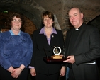 Pictured receiving a presentation from Barbara Davis, Hon Secretary of Powerscourt Select Vestry (centre) and Georgina Masterson, Hon Secretary of Kilbride Select Vestry (left) is the newly installed Archdeacon of Glendalough, the Venerable Ricky Rountree.