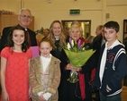 Archbishop Neill, Betty Neill and the Revd Sonia Gyles, Rector, are pictured with local children after they presented the Archbishop and Betty with gifts to mark their last official function in Sandford Parish Church, the dedication of the St Francis stained glass window. 