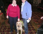 Lesley Rue, Anne Taylor and their canine friend Alfie pictured at the Peata Carol Service in Christ Church Cathedral.
