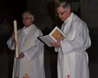 Associate vicar of Wicklow and Killiskey, Revd Ken Rue and rector of Wicklow and Killiskey, Canon John Clarke, prepare to light the Easter Candle at the Easter Vigil at Killiskey Church. 