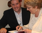 Pictured getting his copy of aspects of Lucan signed by one of the contributors (Linda Curran) is Paul Gogerty TD.