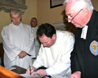 The new Bishop’s Curate of the parishes of Holmpatrick and Kenure with Balbriggan and Balrothery, Revd Anthony Kelly, signs the register witnessed by the Archbishop of Dublin, the Most Revd Dr Michael Jackson; registrar, Canon Victor Stacey; and Archdeacon of Dublin, the Ven David Pierpoint.
