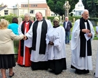 Clergy greet people who had been at the closing service for St Maelruain’s Flower Festival and Festival of Hands in Tallaght. Pictured from left are Auxiliary Priest, the Revd Avril Bennett; the Archbishop of Dublin, the Most Revd Dr Michael Jackson; the Rector of Tallaght, the Revd William Deverell; parish reader, Victoria Osho; former Rector of Tallaght and current Chaplain of the Mageough Home, the Revd Robert Kingston and Auxiliary Bishop of Dublin, the Most Revd Eamonn Walsh. 